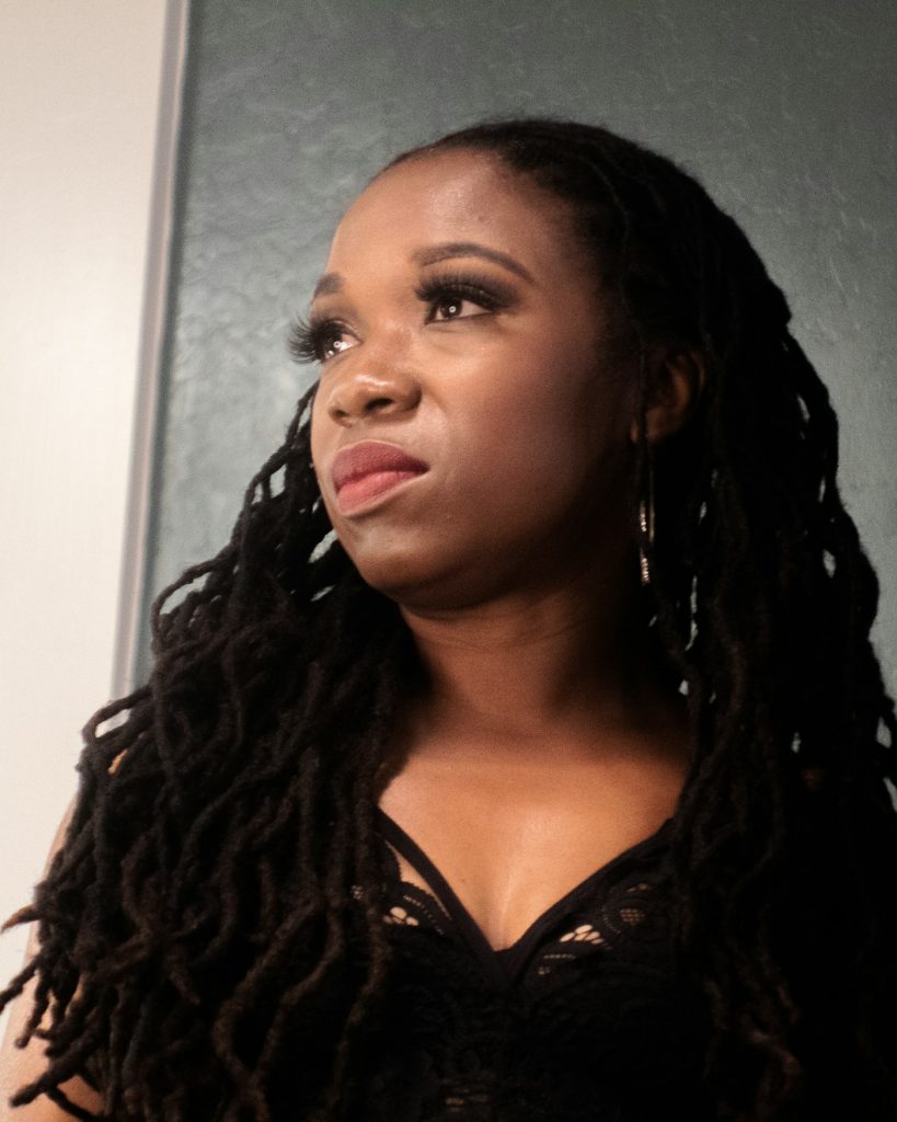 Distressed faux locs styled at a natural hair salon in San Diego