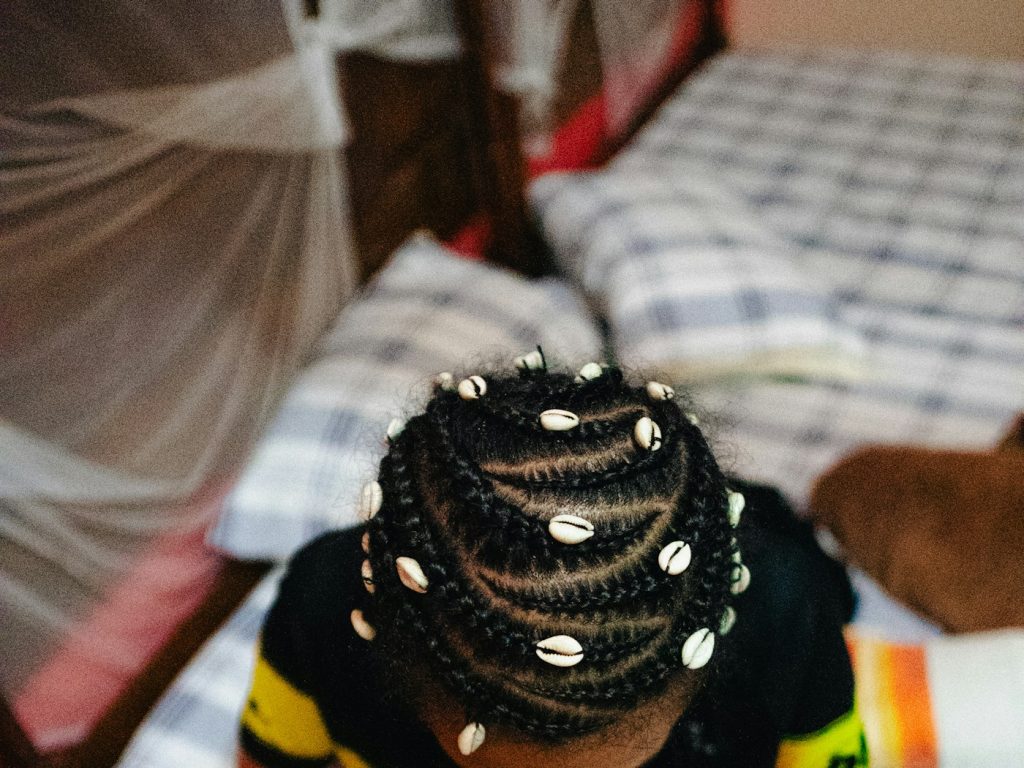 Child wearing beaded braids, kids braids San Diego