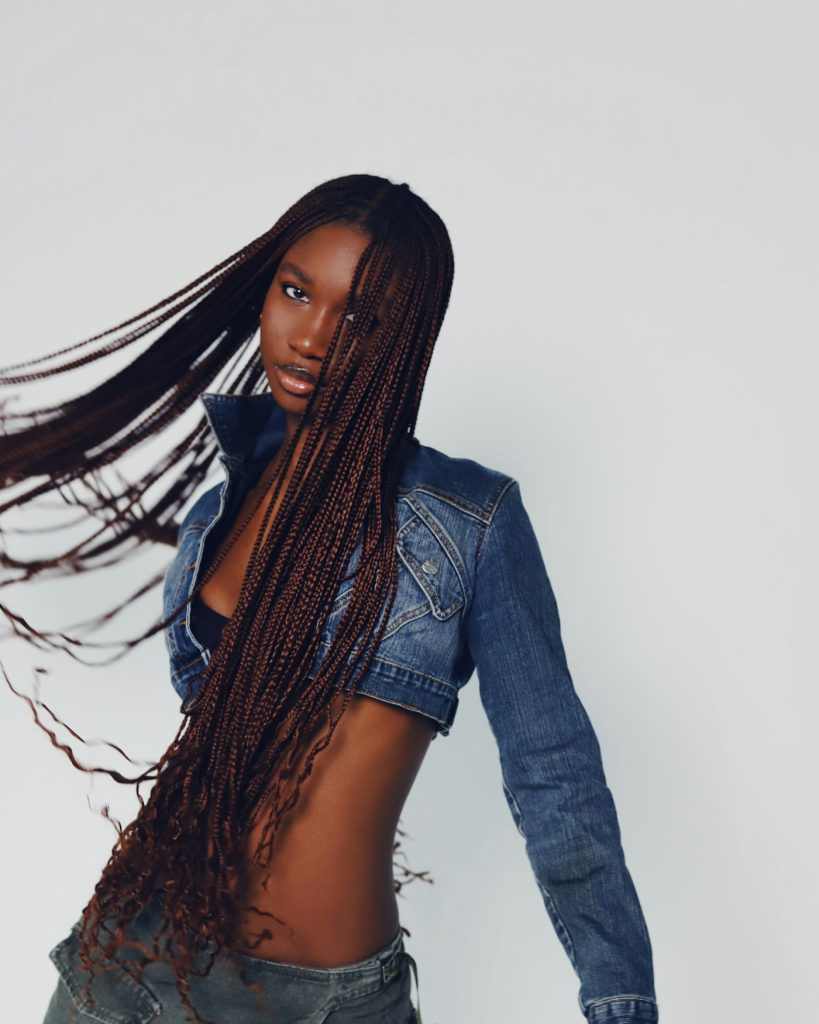 Long knotless braids styled with a denim jacket, knotless braids San Diego