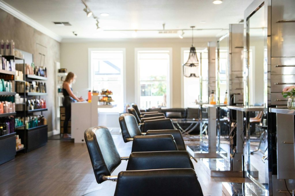 Bright modern braiding salon interior in San Diego