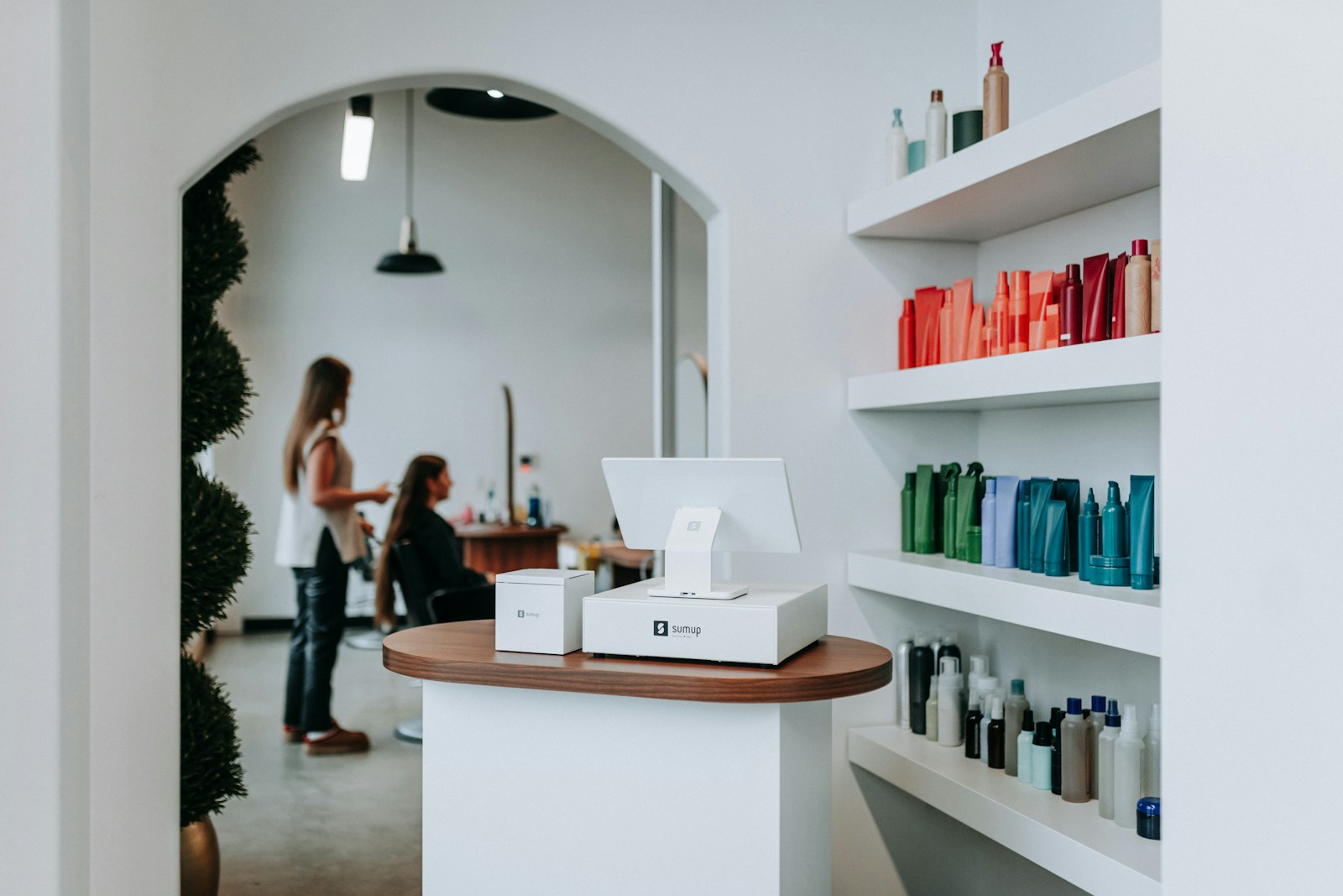 Braiding salon interior with styling stations and products, San Diego